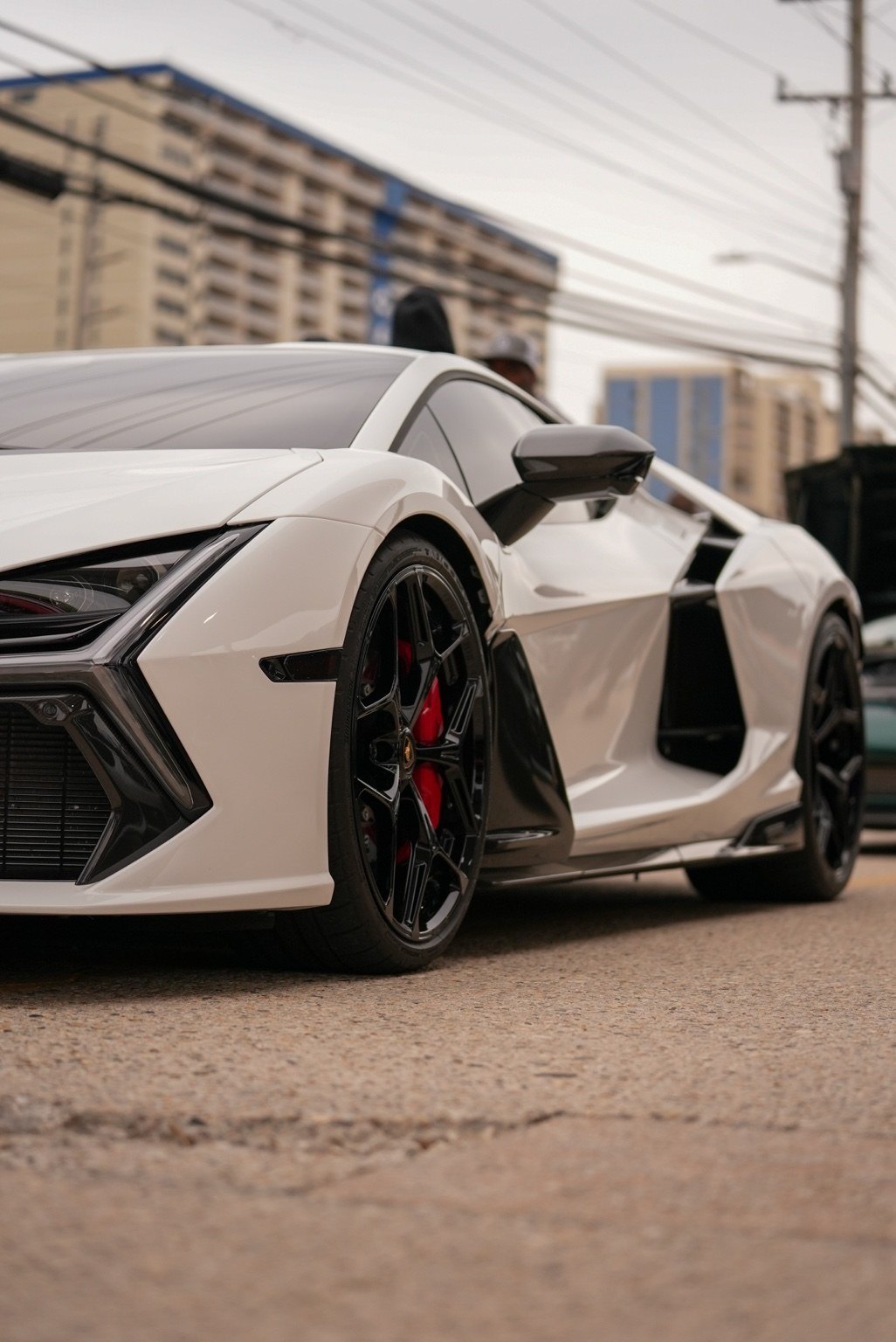 White exotic performance car low-angle detail