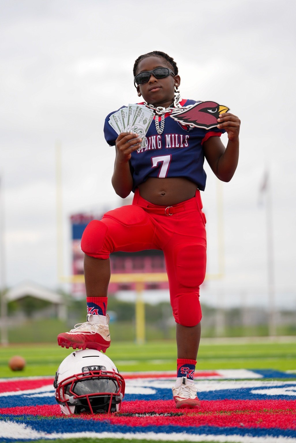 Youth football player posing on the field