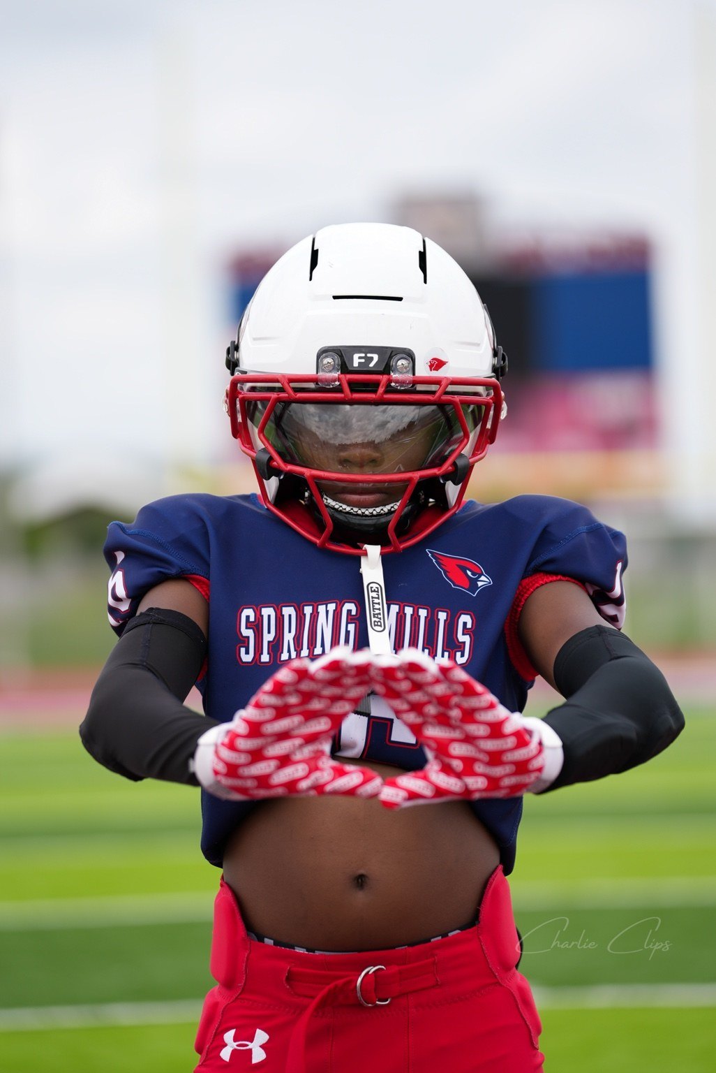 Football player close portrait with gloves