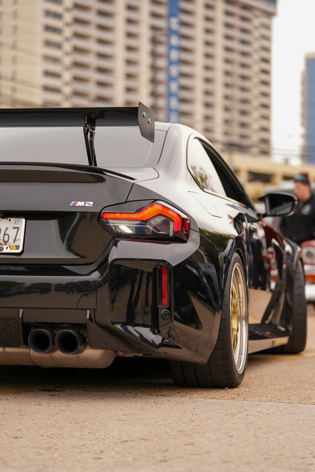 Lineup of black Toyota Supras with hoods open