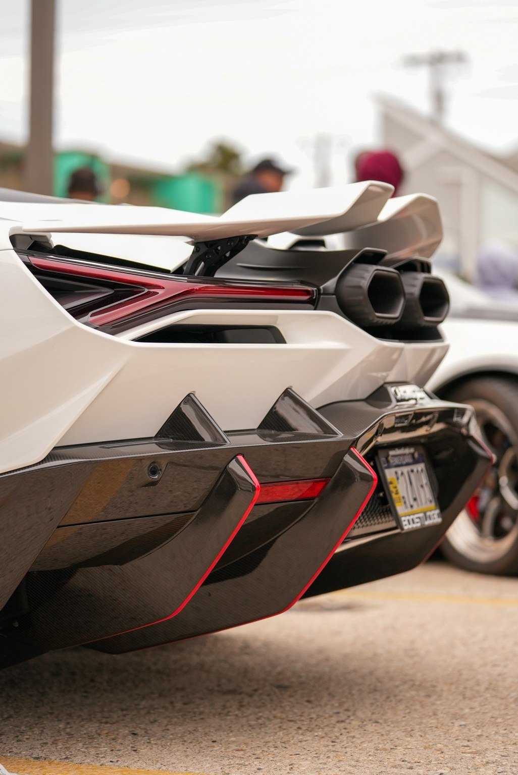 White exotic sports car rear diffuser detail