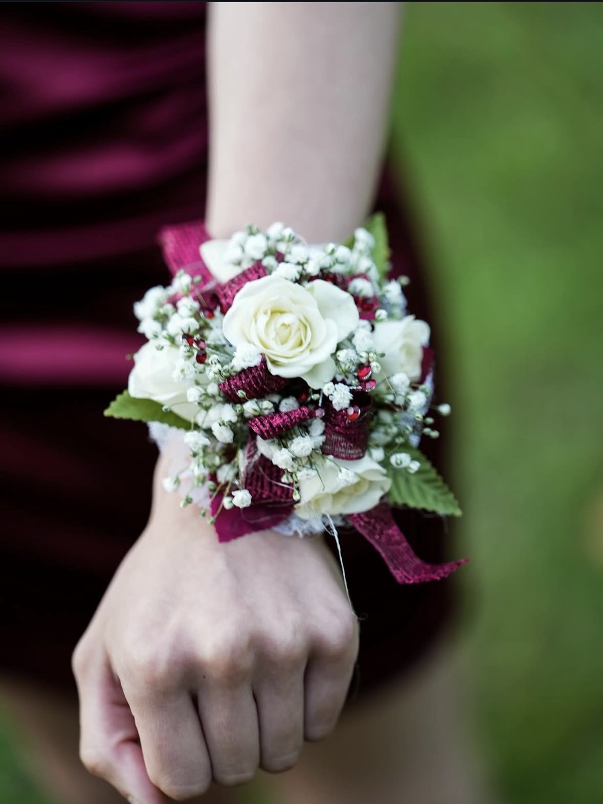 Burgundy and white prom corsage detail