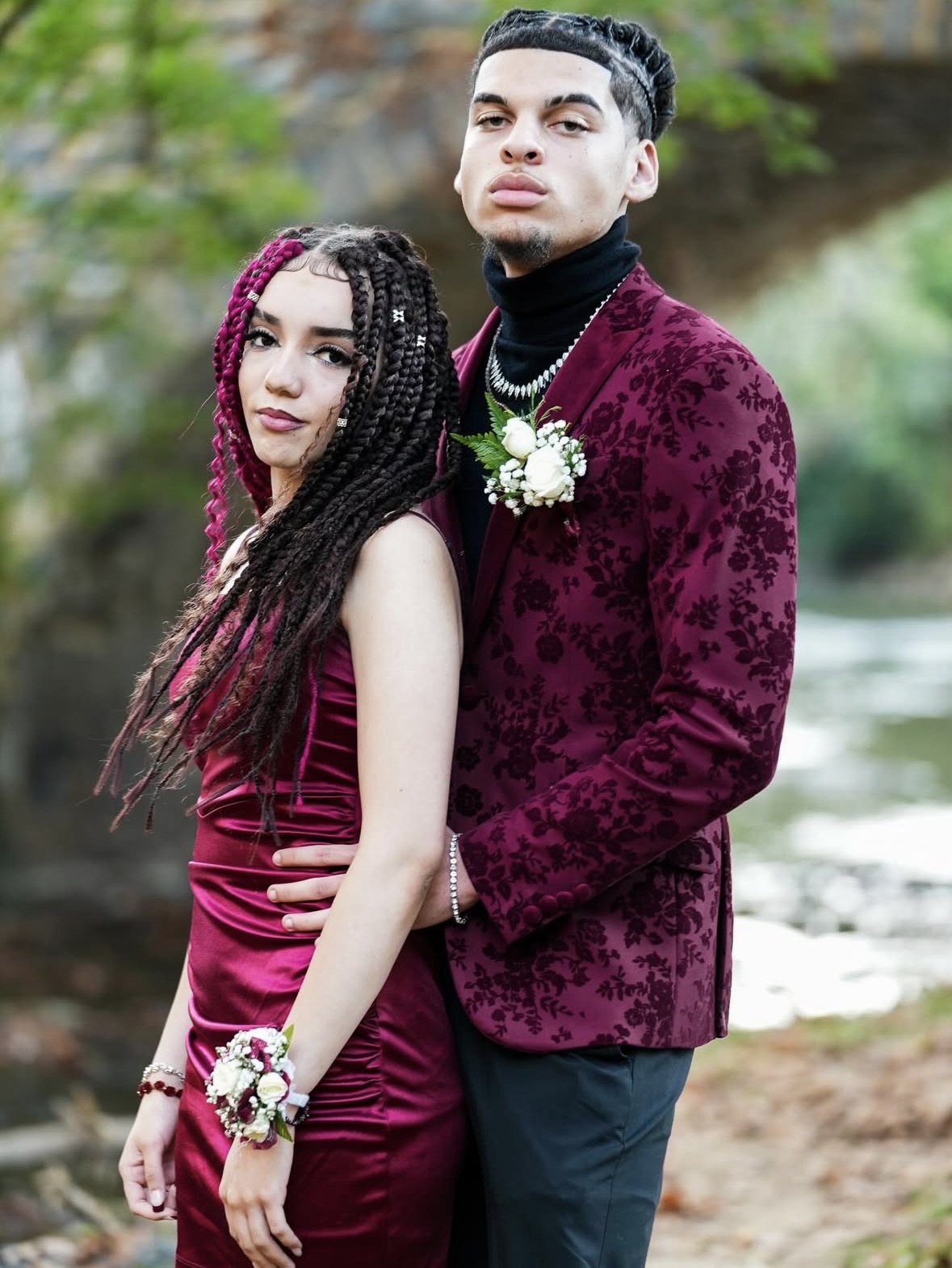Prom couple close portrait in burgundy formalwear