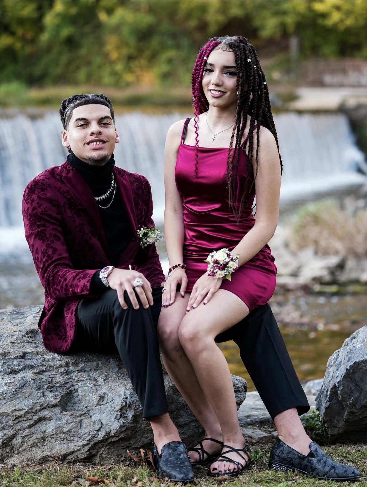 Prom couple portrait by a waterfall
